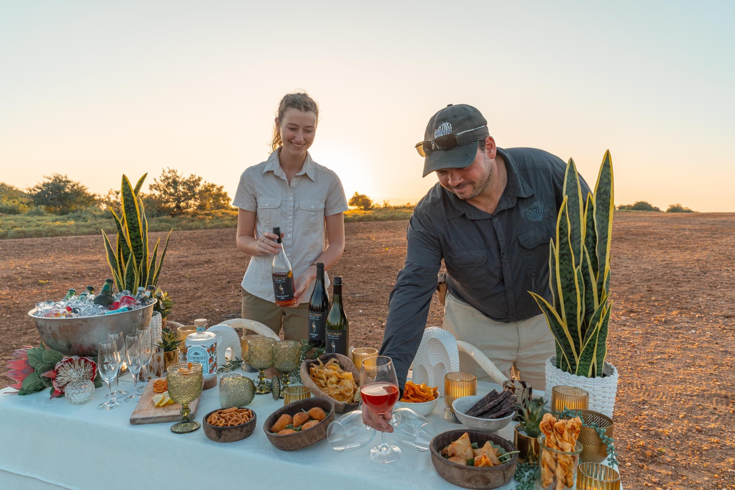 Nzumba staff serving a drinks stop on a Klaserie game drive