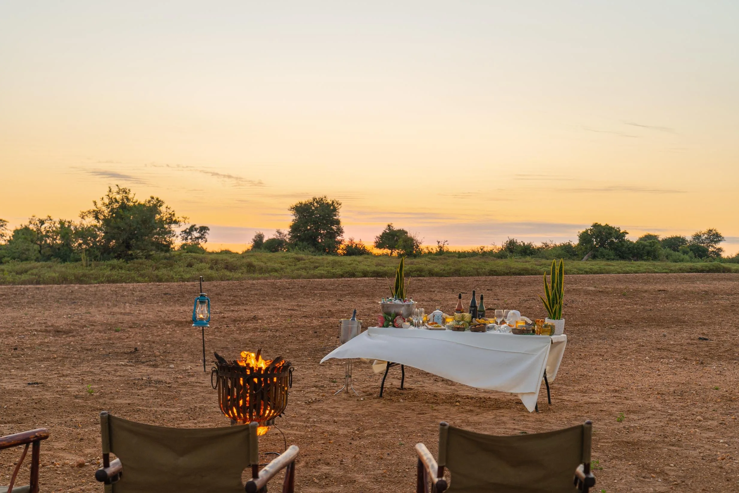 Game-drive drinks stop with the bushveld stretching beyond