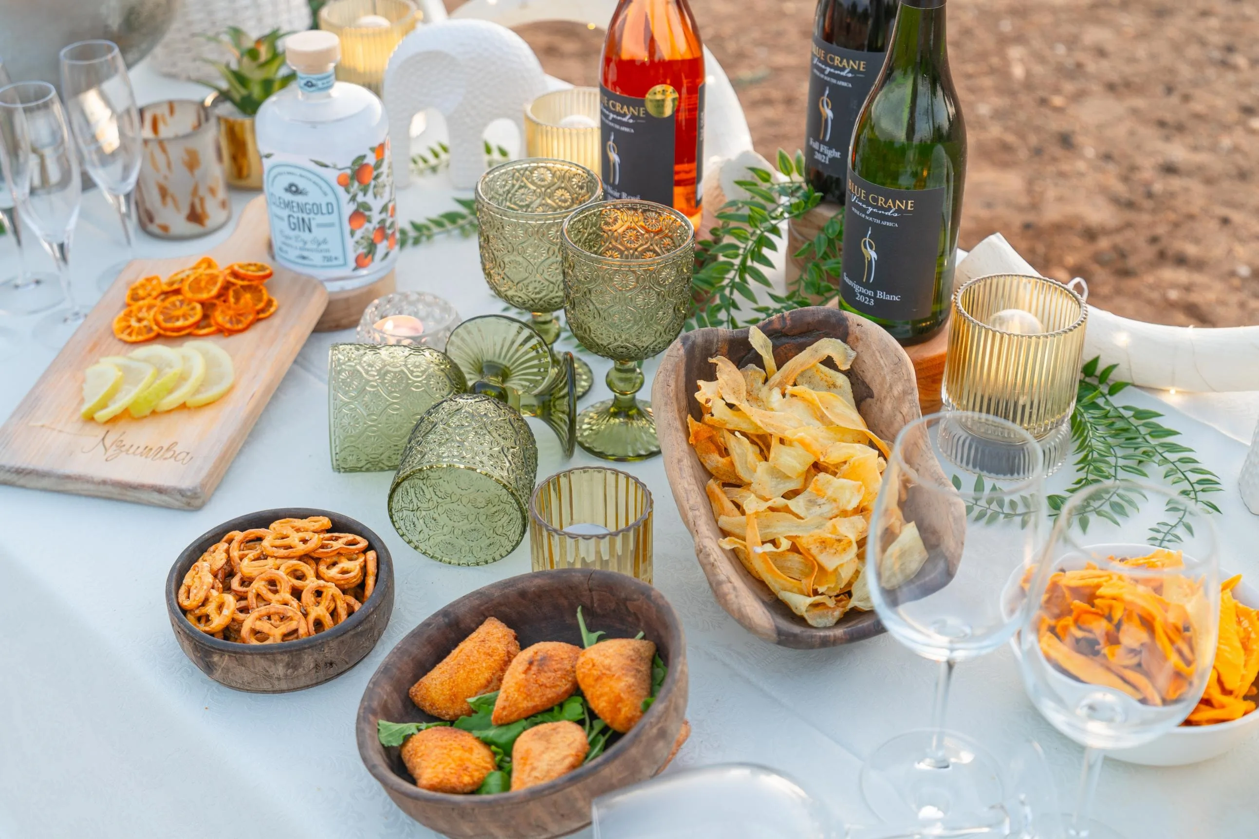 An evening sundowner table set up between game-drive activities