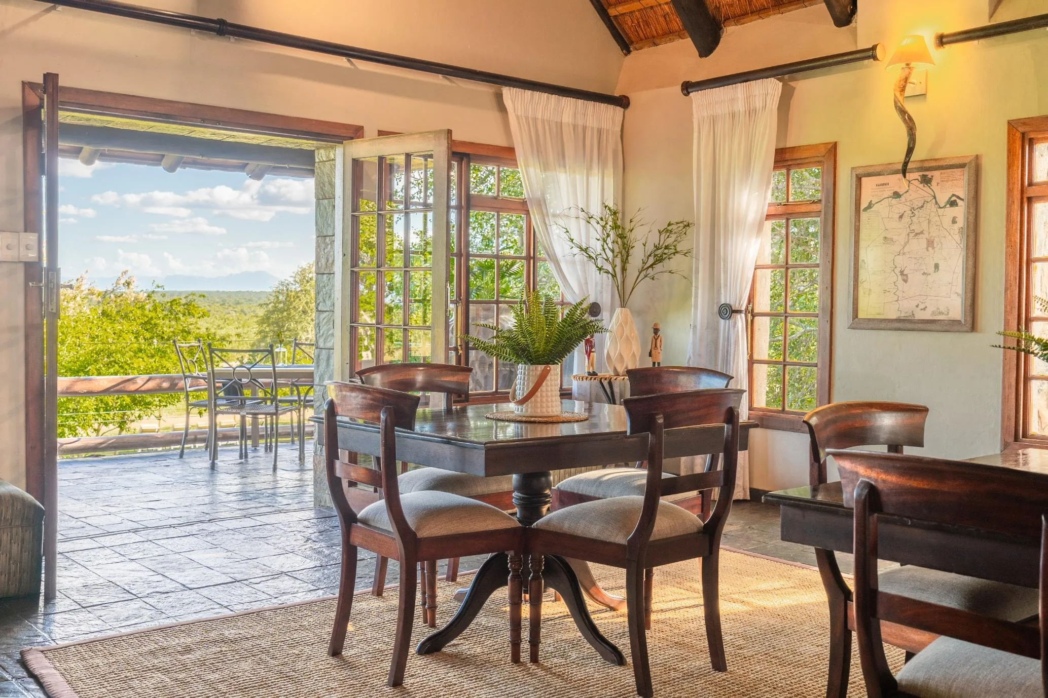 A reading nook in the Nzumba Lodge main area, looking onto the bushveld