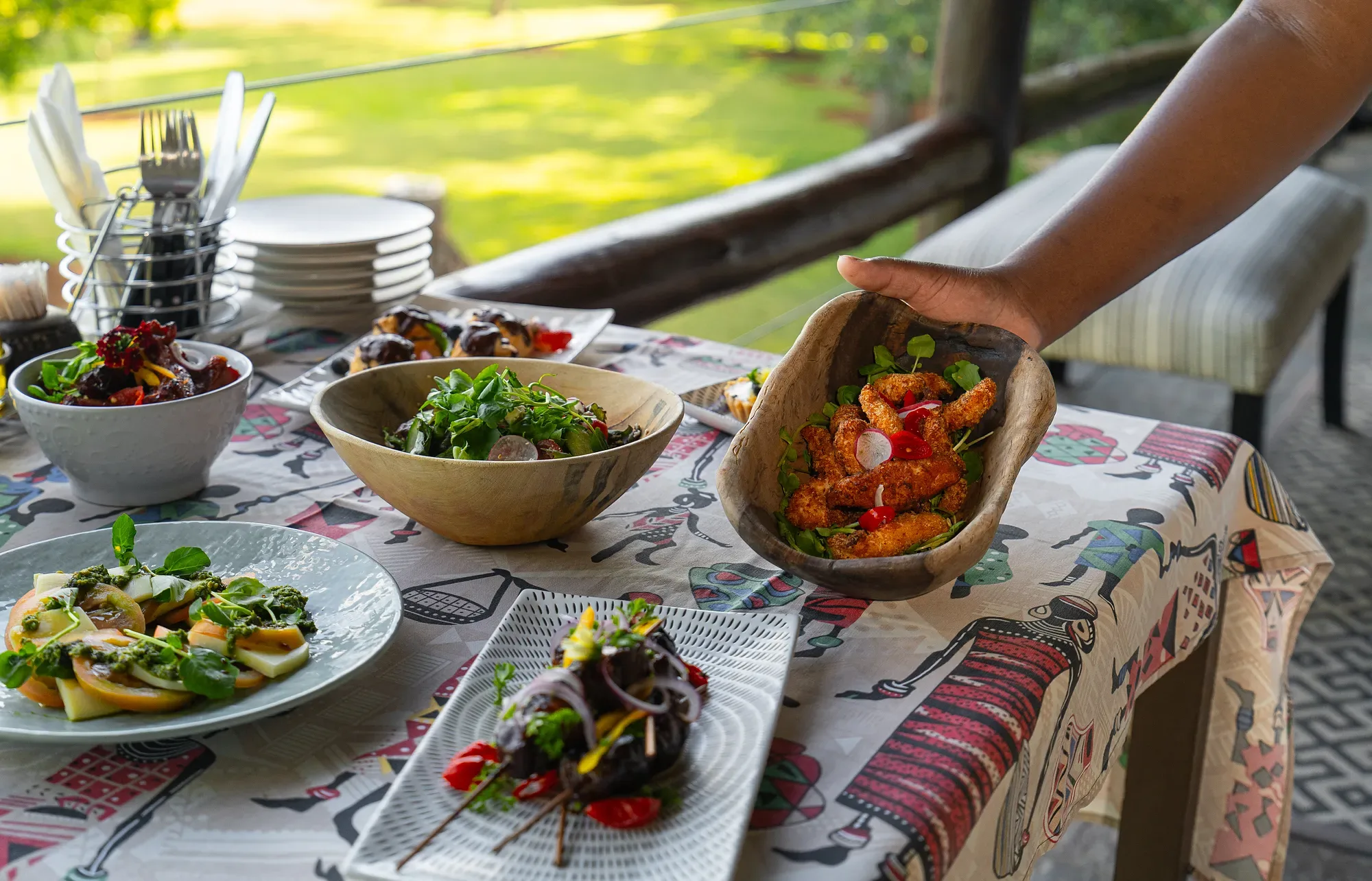 Nzumba Lodge high tea — sweet and savoury bites on a printed African cloth