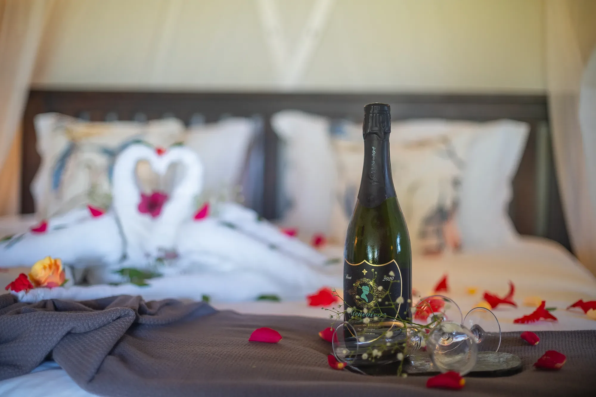 A romantic chalet turn-down at Nzumba Lodge with bathtub, candles and rose petals