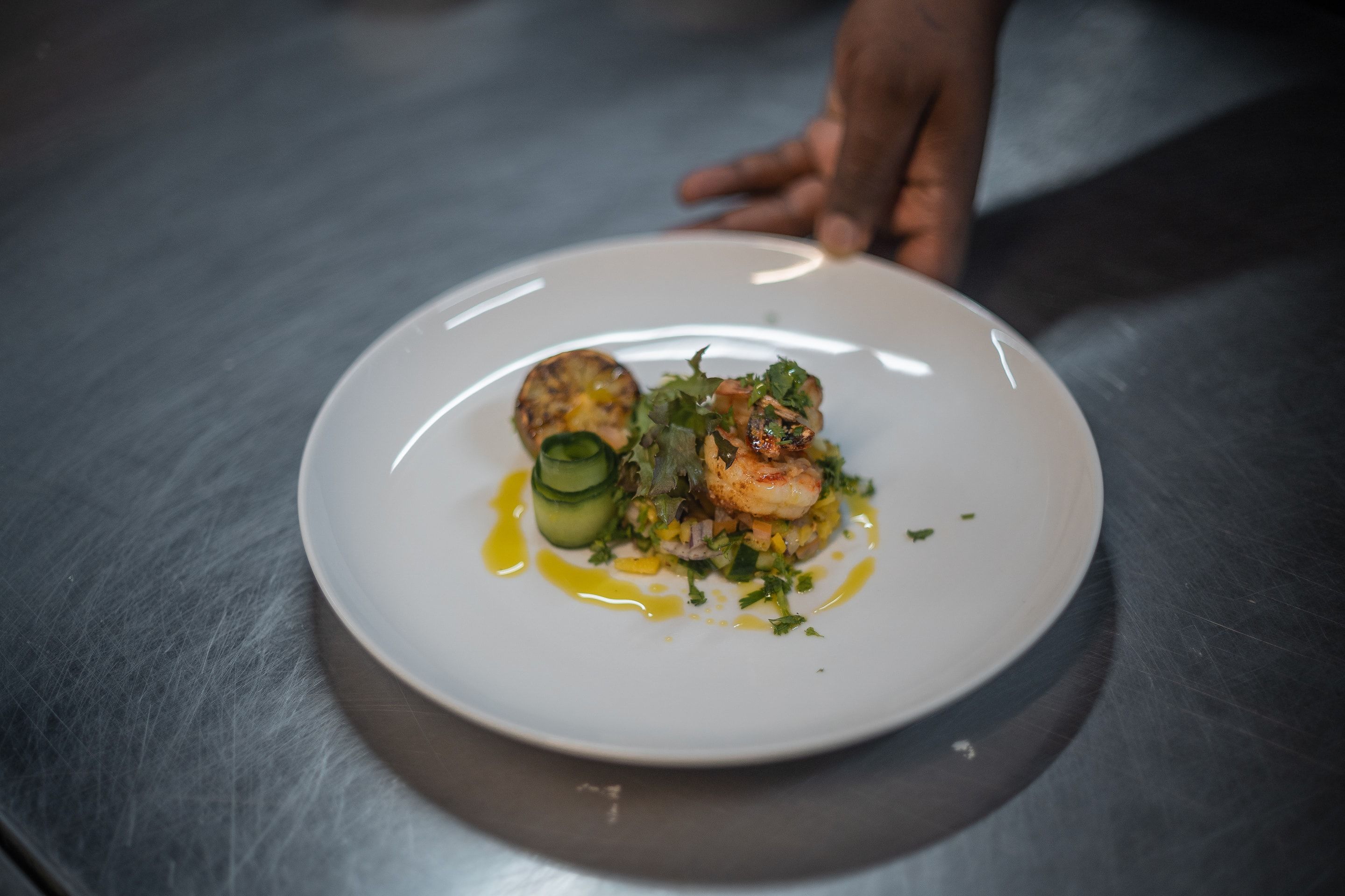An elegantly plated Nzumba dinner — fresh, locally inspired cuisine
