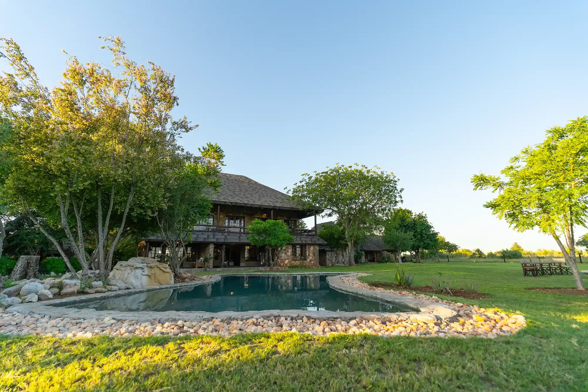 The Nzumba Lodge pool by daylight surrounded by Klaserie bushveld