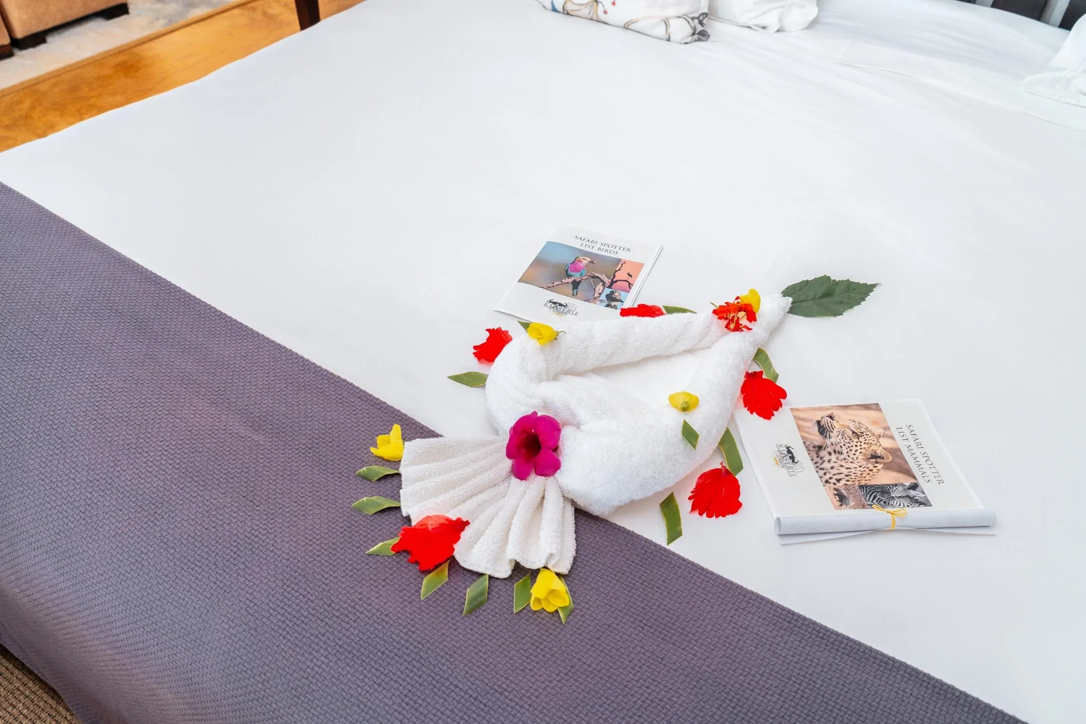 The bedroom of a Nzumba chalet — crisp linen and natural light