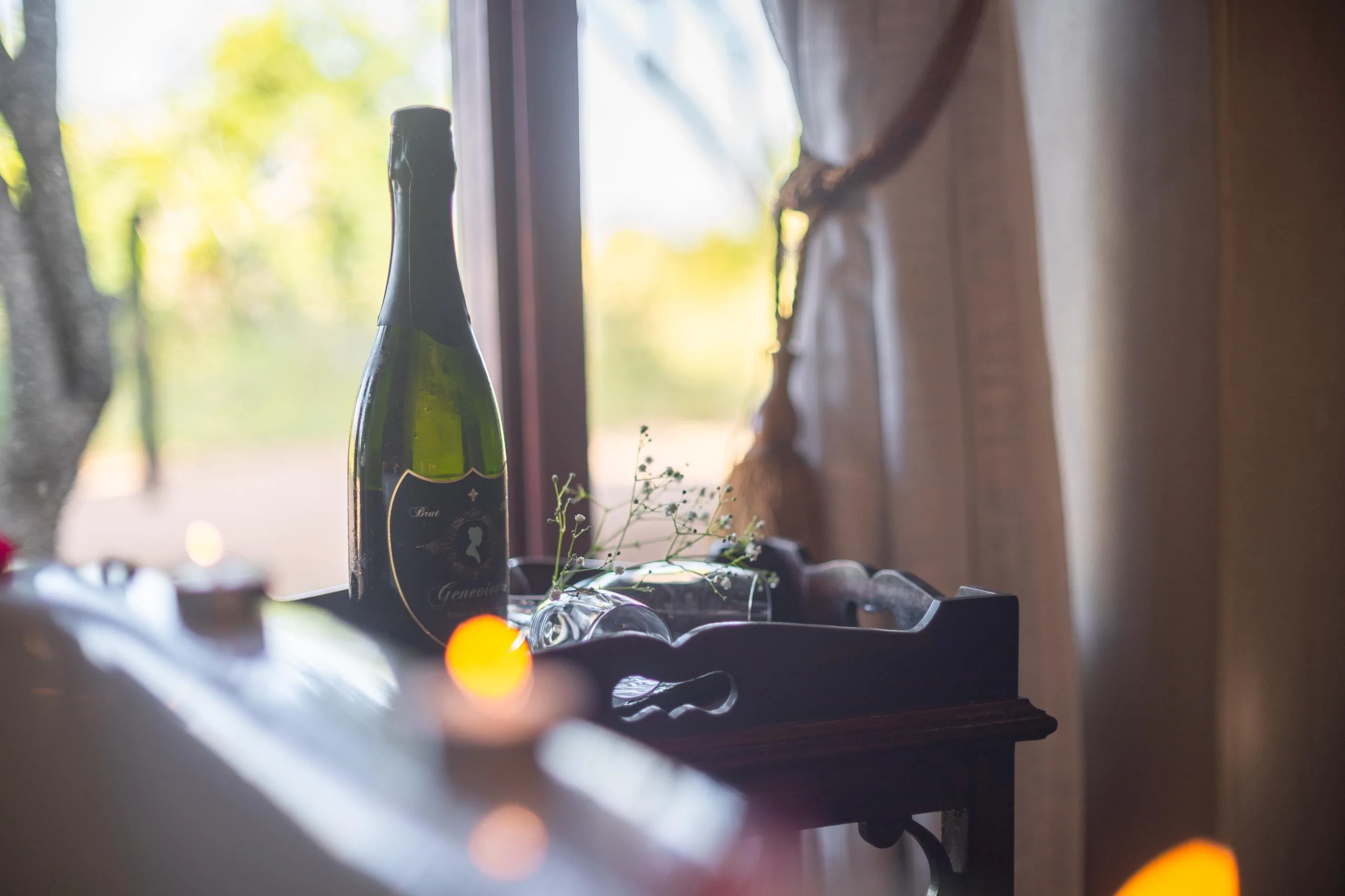 A romantic turn-down at a Nzumba chalet — folded linen and petals